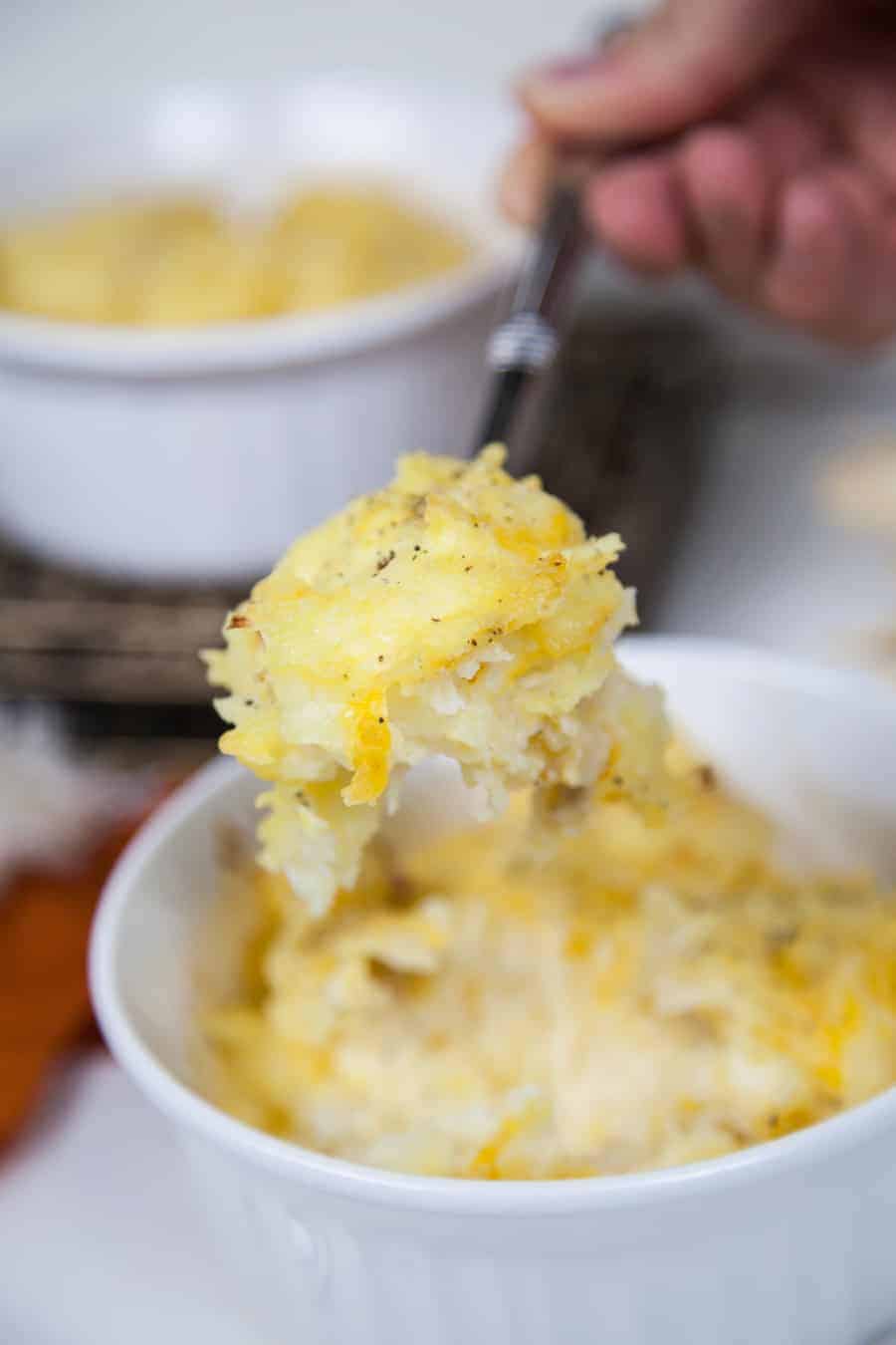 This recipe for Shredded Cheesy Potatoes is the perfect side dish for all of your holiday parties and family get togethers!