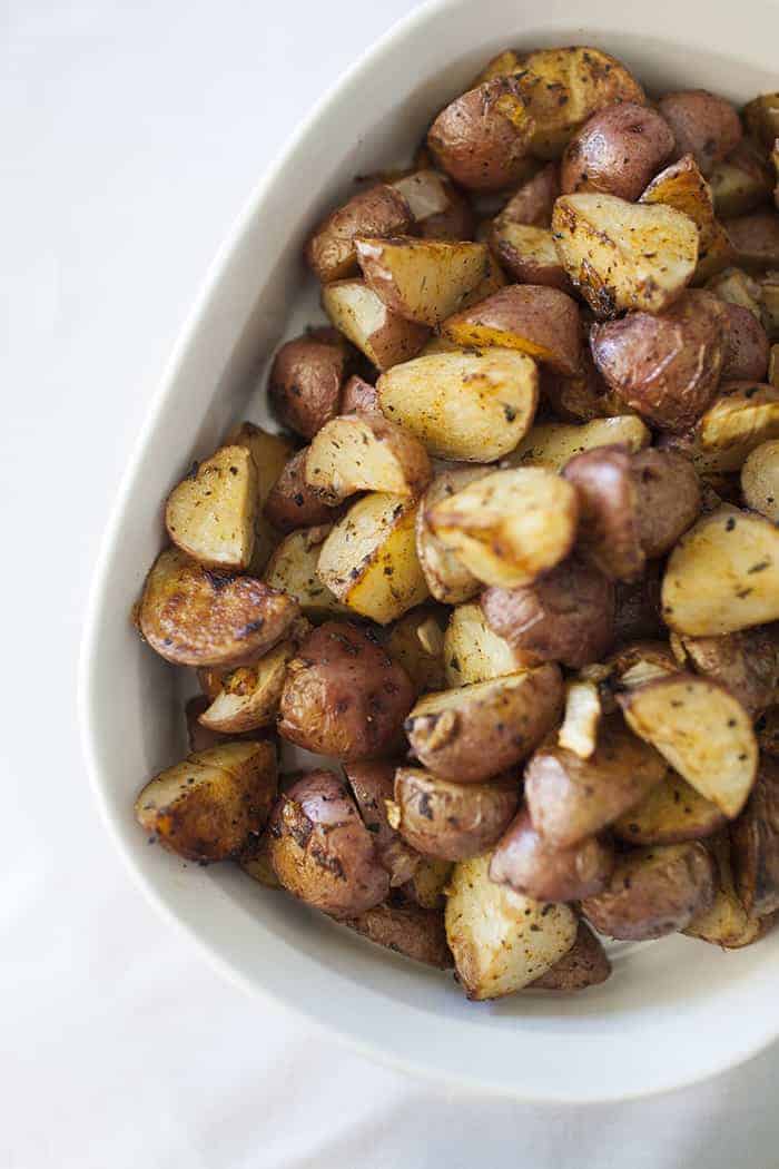 Breakfast potatoes in a white bowl.