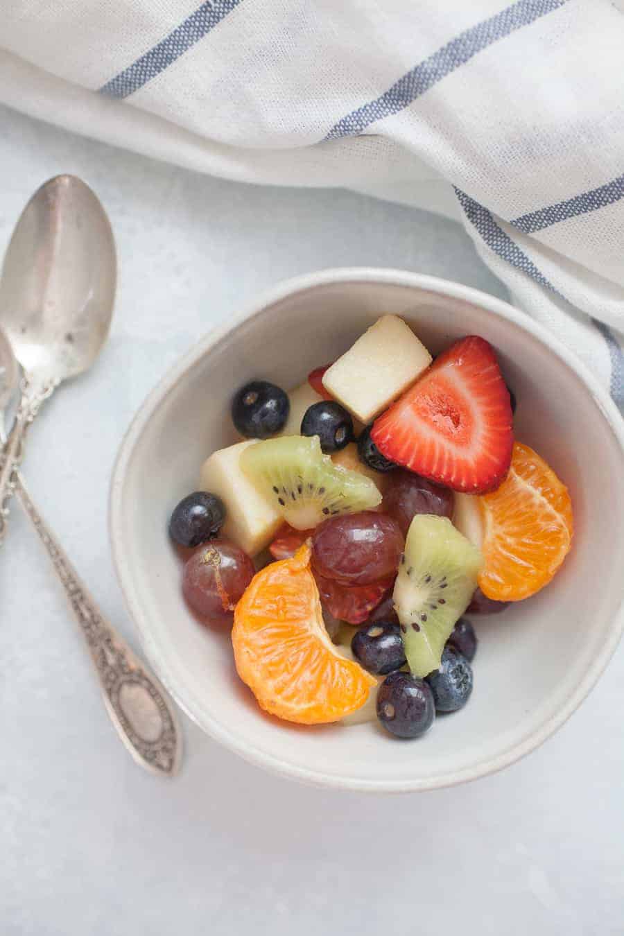 Orange Juice Fresh Fruit Salad is a twist on a classic fruit salad. It's perfect for serving for brunch, showers, or just as a healthy side dish for dinner! Perfect to customize with whatever fruit you have on hand, too! 