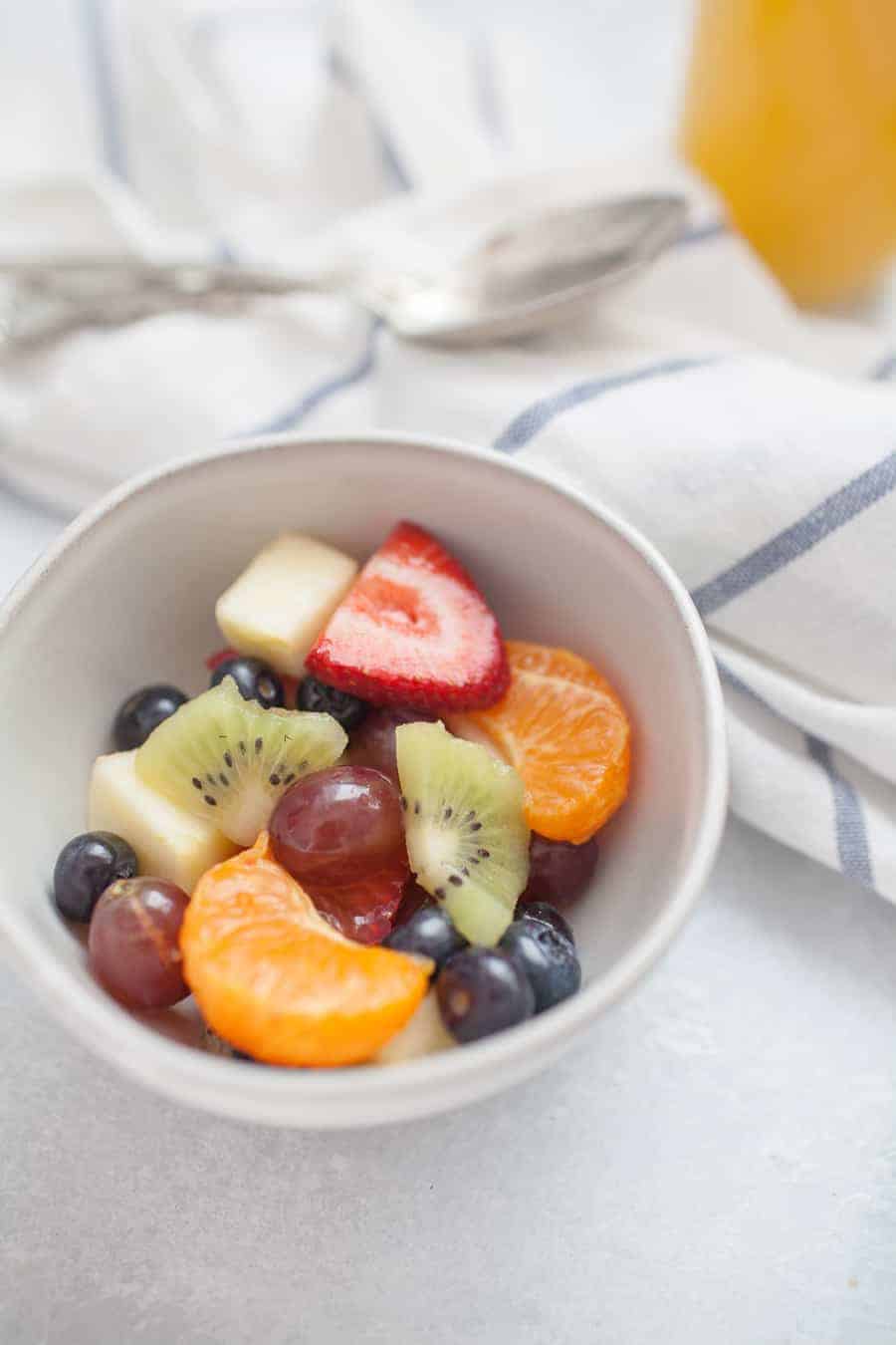 Orange Juice Fresh Fruit Salad is a twist on a classic fruit salad. It's perfect for serving for brunch, showers, or just as a healthy side dish for dinner! Perfect to customize with whatever fruit you have on hand, too! 