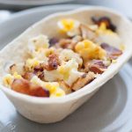 These bacon breakfast scramble bowls are the perfect way to start the weekend! Customize these bowls with your favorite breakfast protein, veggies, and toppings like cheese, green chile or salsa. Or keep them simple with potatoes, eggs and bacon! Either way, these breakfast bowls are sure to be a hit with your family.