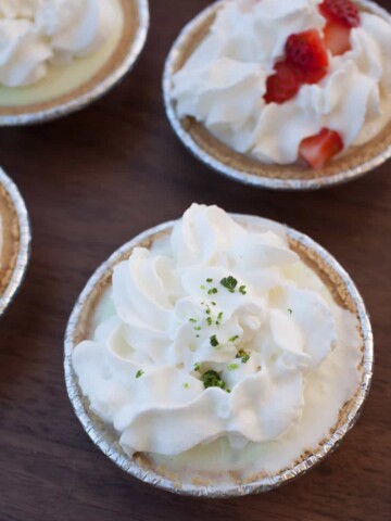 These quick, no bake whipped cream pies are the perfect way to serve dessert this summer! Try these three easy recipes for key lime cream pie, strawberries and cream pie, and coconut pineapple cream pie.