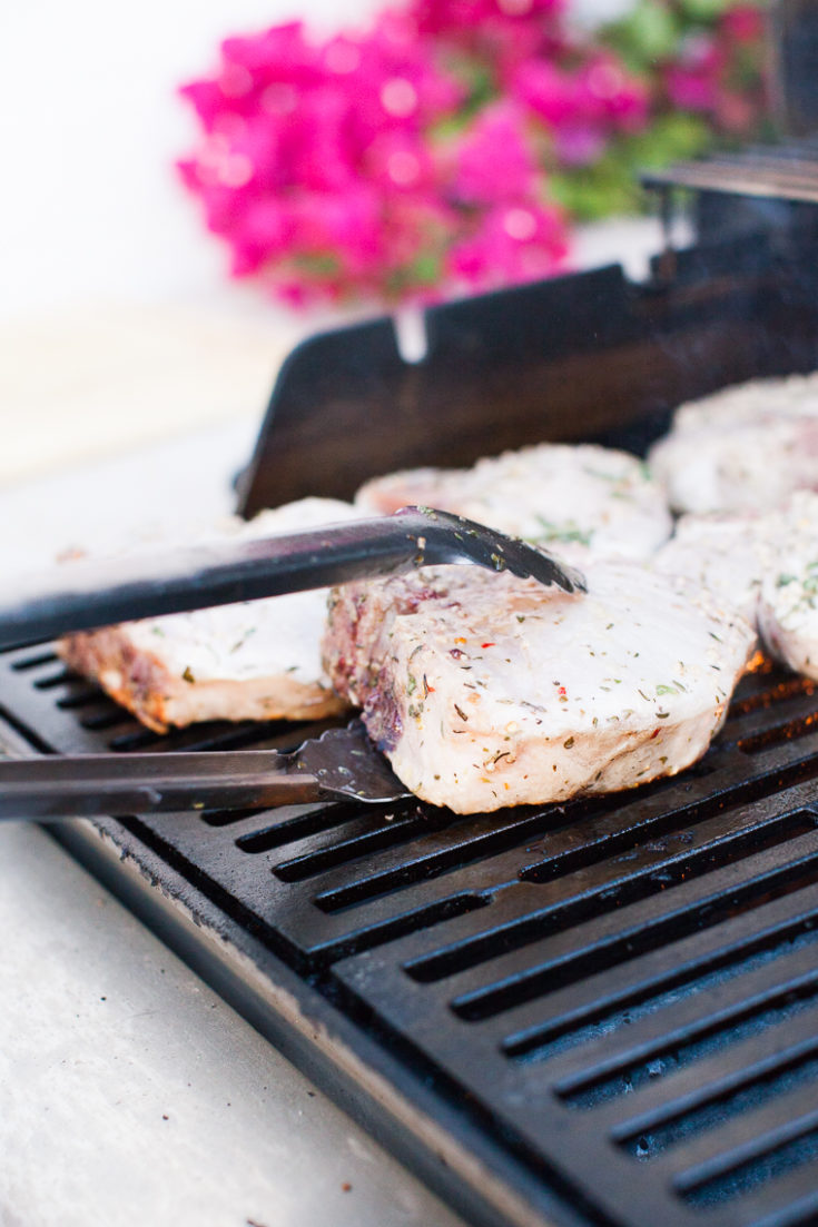 tongs holding a porkchop