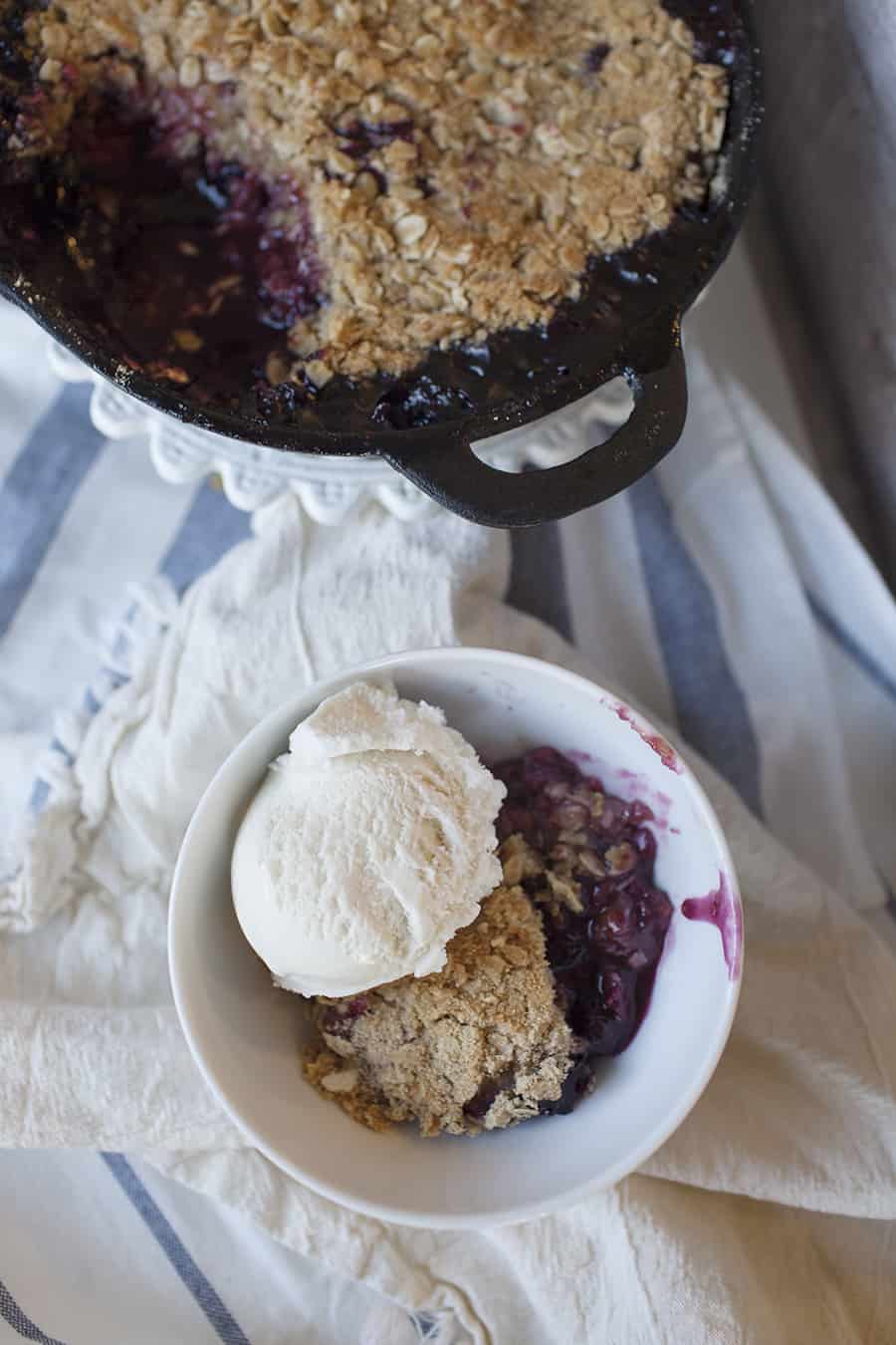 This cast iron mixed berry crisp is the perfect quick dessert! You can easily sub out the fruit for whatever you have on hand for a delicious after-dinner treat!