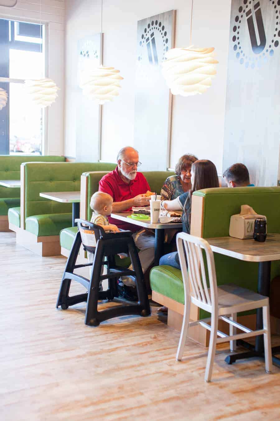 A group of people eating in a restaurant.
