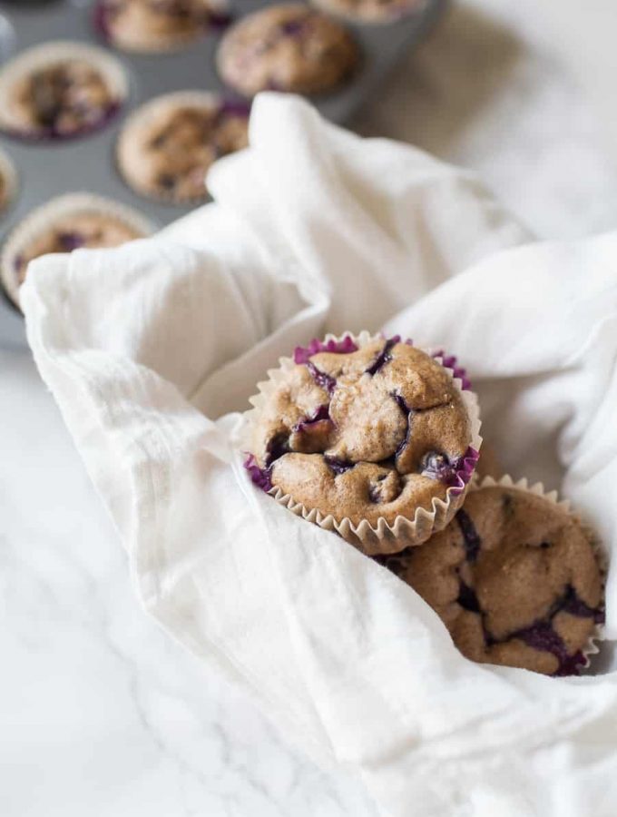 Looking for a healthy treat that can be served to adults and children alike? These healthy no sugar added blueberry muffins are the perfect treat because they are sweetened naturally with dates, instead of added sugar and can be quickly thrown together using just your blender! no sugar added | blender muffins | blueberry muffins | toddler snacks | toddler muffins | easy blueberry muffin recipe | no sugar added muffins | healthy muffins | easy muffins recipes