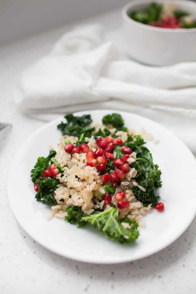 This salad takes less than 10 minutes to make and the flavors are perfectly light and simple for springtime. A Spring Pomegranate Brown Rice Kale Salad is the perfect addition to any spring meal. spring salads | pomegranate recipes | kale salad recipes | kale salad | kale spring salad | rice salad | brown rice salad | brown rice and kale recipes