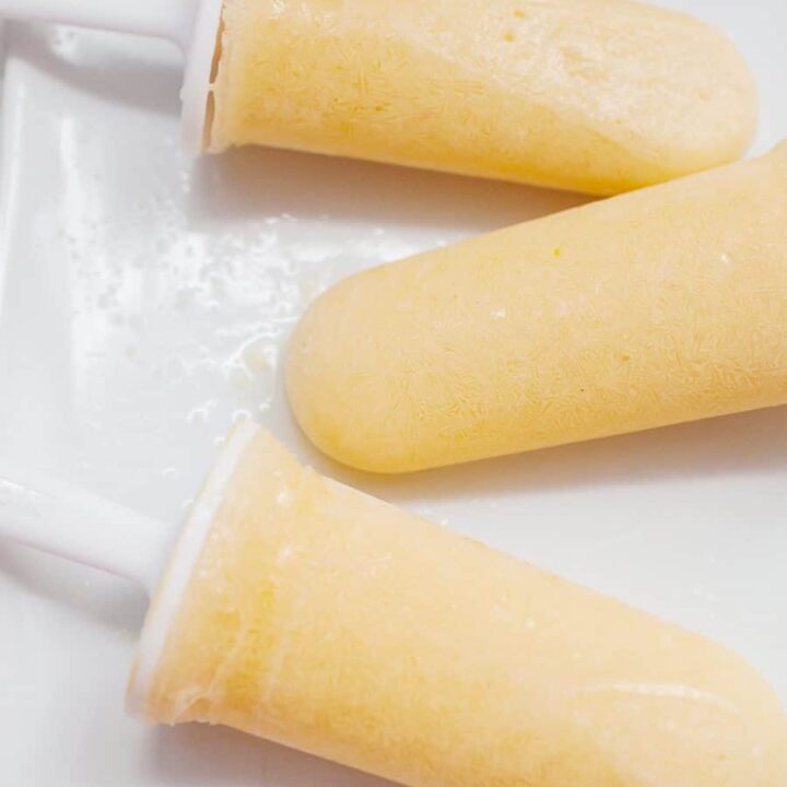 These healthy peach lemonade popsicles are the perfect summer treat! Cool down with these refined sugar free, creamy, fruity pops.