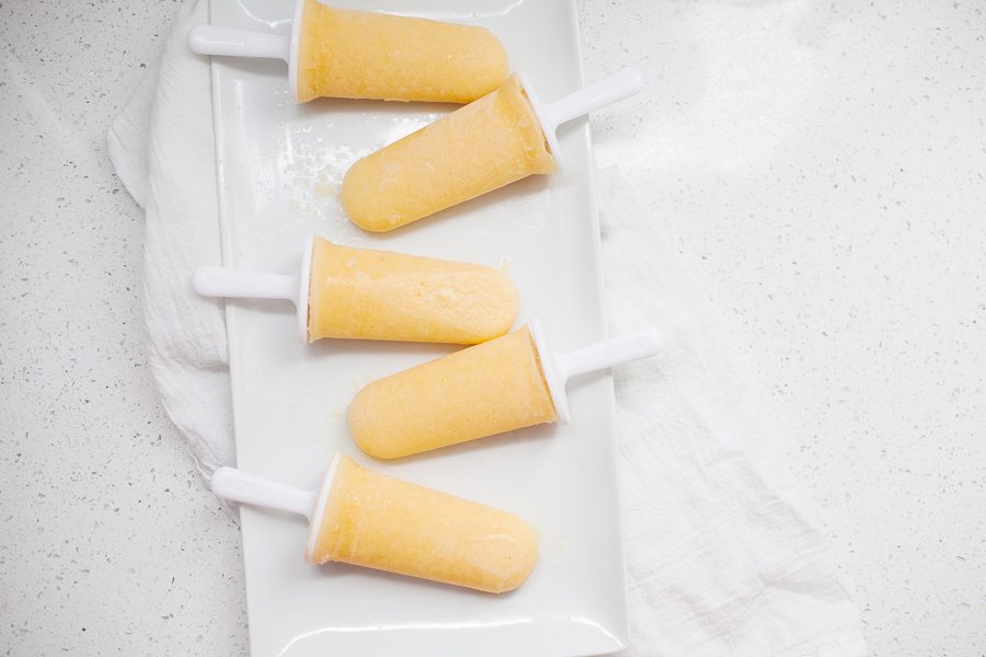 These healthy peach lemonade popsicles are the perfect summer treat! Cool down with these refined sugar free, creamy, fruity pops.