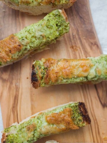 Cheesy Ranch French Bread makes a perfect pre-dinner appetizer! It's great for a crowd or just for your family while dinner finishes cooking. Made with homemade ranch dressing, this french bread is packed with fresh ingredients and will make the wait for dinner much more enjoyable.?