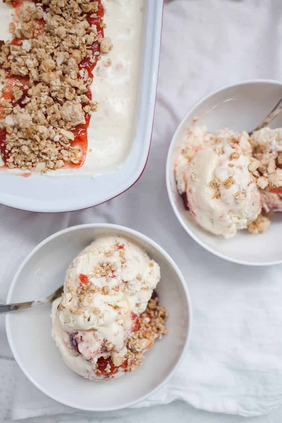 Two bowls of strawberry ice cream with granola and
Spinach.