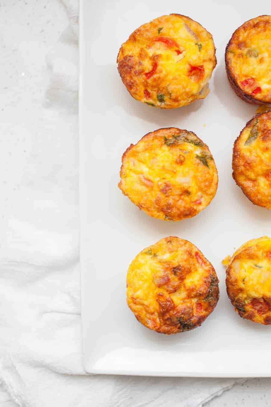Simplify your breakfast routine with Make Ahead Breakfast Frittata Muffins. With this delicious recipe, you'll have breakfast prepped for the week. These frittata muffins are packed with flavor and you can even customize them to use up the vegetables you have on hand.