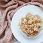 A white plate with Apple Crumble Muffins on it.