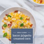Overhead view of two bowls filled with bacon jalapeño creamed corn, with a hint of label and website text at the bottom.
