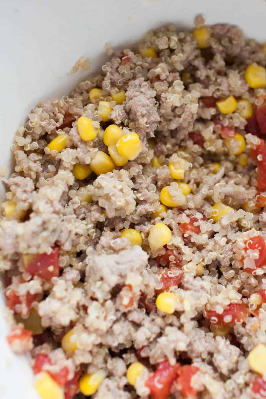 quinoa with corn, ground turkey and tomatoes in a bowl