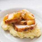 Herb crusted apple pan seared pork tenderloin is the perfect fancy but easy dish you can make at home. You'll be surprised how quickly this decadent pan seared pork tenderloin comes together. The entire tenderloin is seared, baked and then topped with a sauce of apple chunks and herbs. Serve over a bed of Yukon gold potatoes and you'll feel like you're having a steakhouse dinner right at home.?