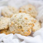 Love having bread with your dinner? These quick, goat cheese rosemary drop biscuits are the solution! These biscuits will trump any store bought bread and the best part is they're ready quickly. Start with a basic drop biscuit recipe and add in a hint of goat cheese and rosemary for a buttery, creamy biscuit. Serve with a slab of butter or as is and you have the perfect bread component to any dinner!?