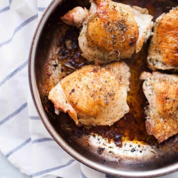 Herb crusted pan seared chicken thighs make a quick, flavorful dinner that the entire family will enjoy! Made with a quick homemade dry rub of seasonings like thyme, rosemary and garlic powder, pan seared chicken thighs have a crisp outer skin and tender meat inside.?These chicken thighs are a favorite weeknight dinner for any time of year.?
