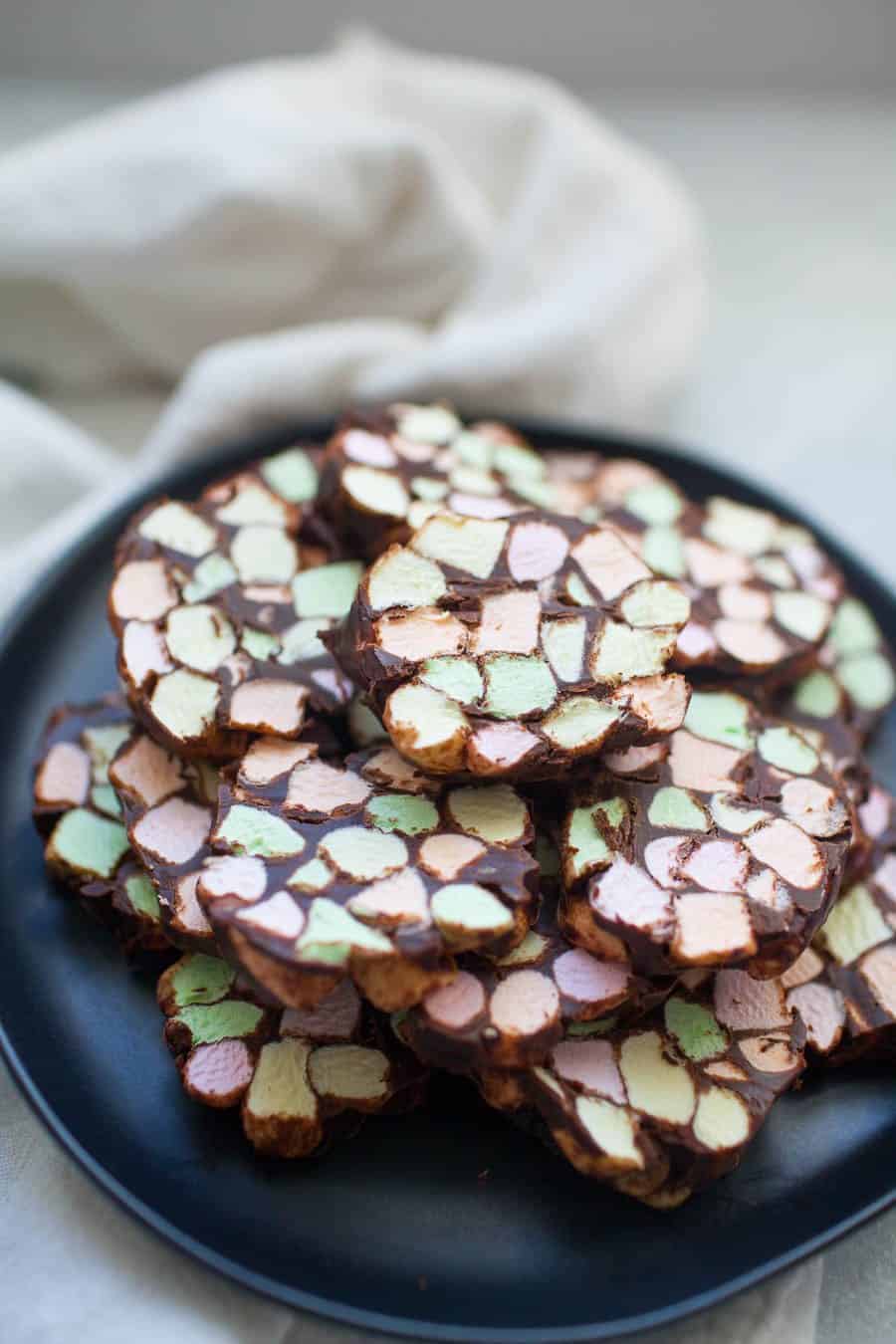 Dark gray stone plate with one inch thick stained glass window cookies.