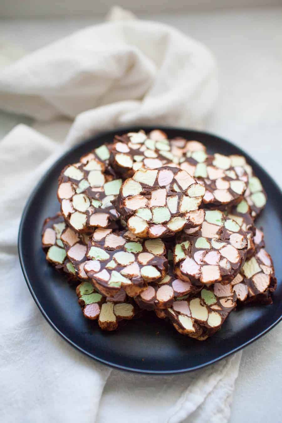 Dark gray stone plate with one inch thick stained glass window cookies.