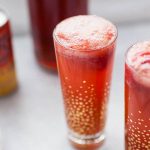 Looking for the perfect, easy drink recipe to serve at a baby shower or brunch? This no sugar added, strawberry ginger punch is perfect for showers, parties, or just for a fun non-alcoholic drink for anytime! It's made with stevia-sweetened ginger beer, homemade strawberry sorbet and a splash of cranberry juice. This punch is flavorful and just sweet enough, without any artificial or added sugars!?