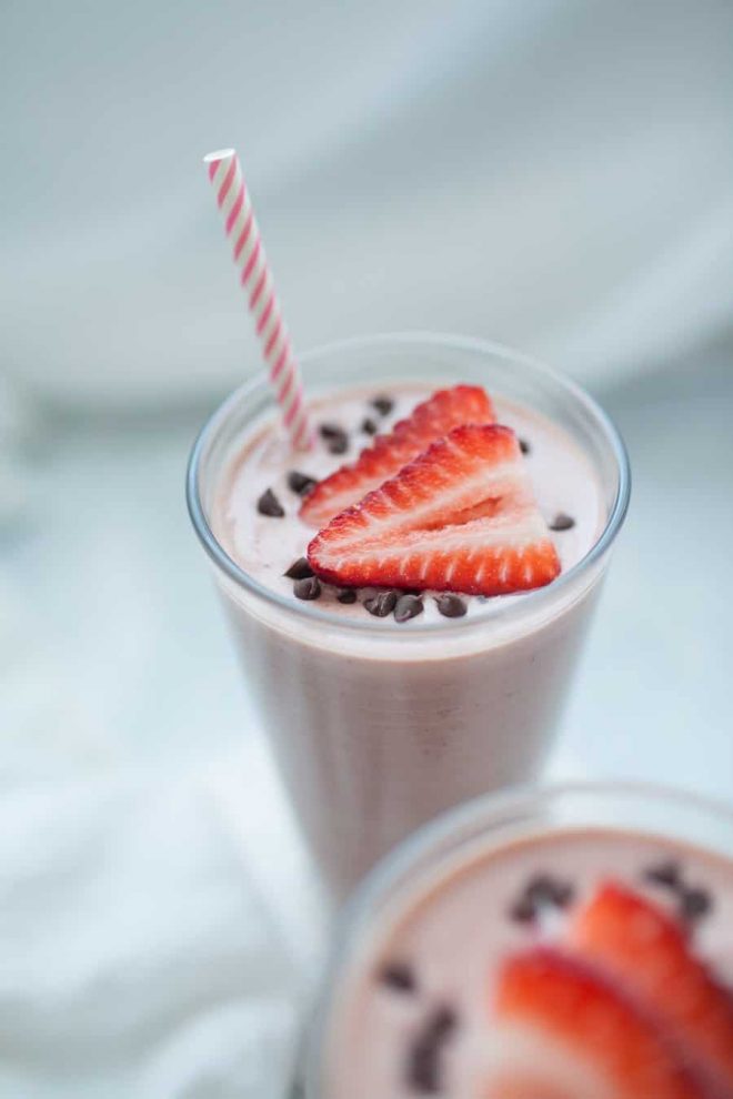 Breakfast should be simple, yet delicious and this recipe for Chocolate Strawberry Greek Yogurt Smoothie definitely covers both! If having chocolate for breakfast is wrong, I certainly don't want to be right! This smoothie is packed with protein from greek yogurt and almond milk too, so this is a breakfast that will keep you full. Perfect for any morning breakfast and especially perfect for a festive treat on Valentine's Day, an anniversary or birthday treat.