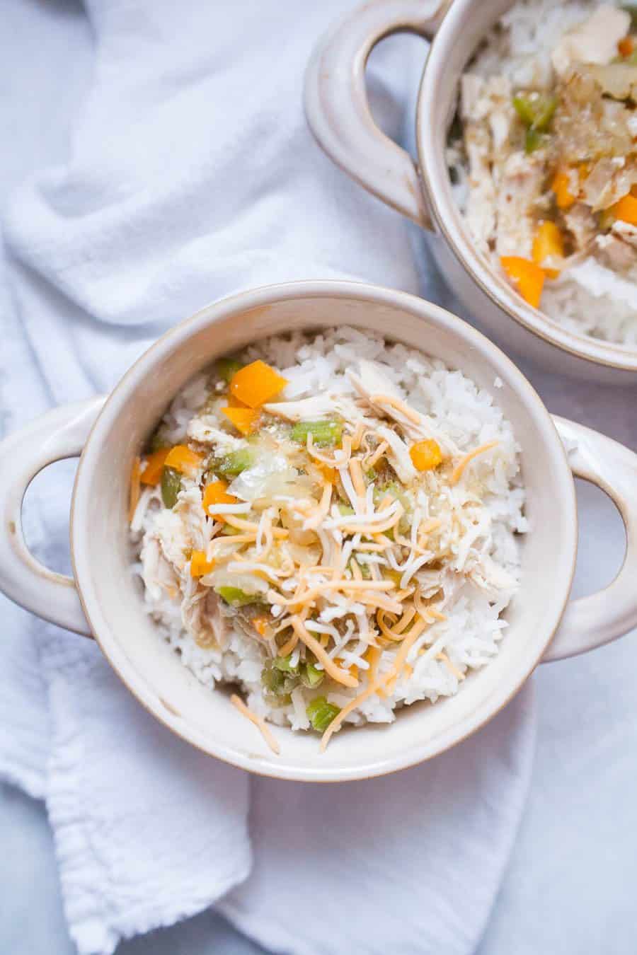 Slow Cooker Salsa Verde Chicken is an easy weeknight slow cooker meal the whole family will love! With just five simple ingredients of salsa verde, chicken, bell peppers, onions and rice, it's ready in a matter of hours and will take the stress out of dinnertime on a busy evening. 