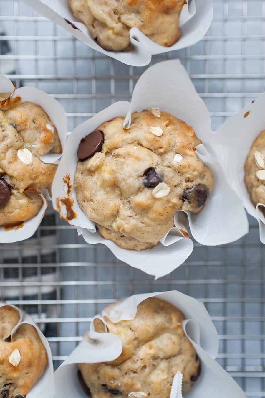 Healthy banana chocolate chip yogurt muffins on a cooling rack