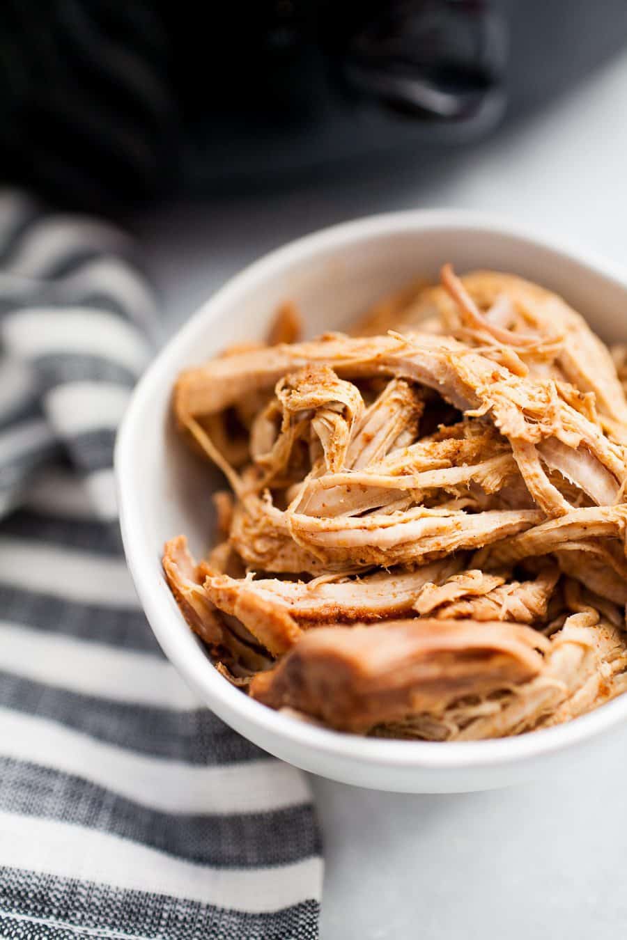 Sugar-free pulled pork in a small, white bowl.