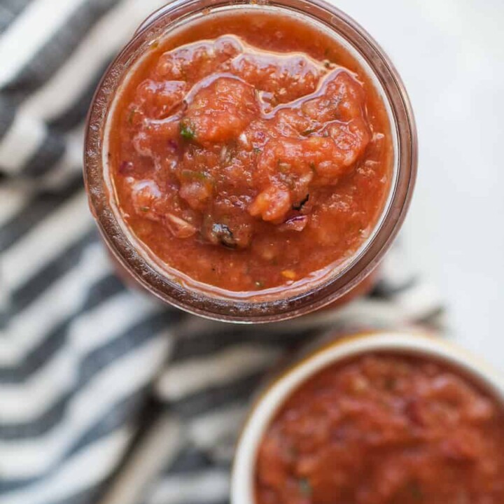 Five Minute Homemade Tomato Sauce in a Jar on a Striped Tablecloth.