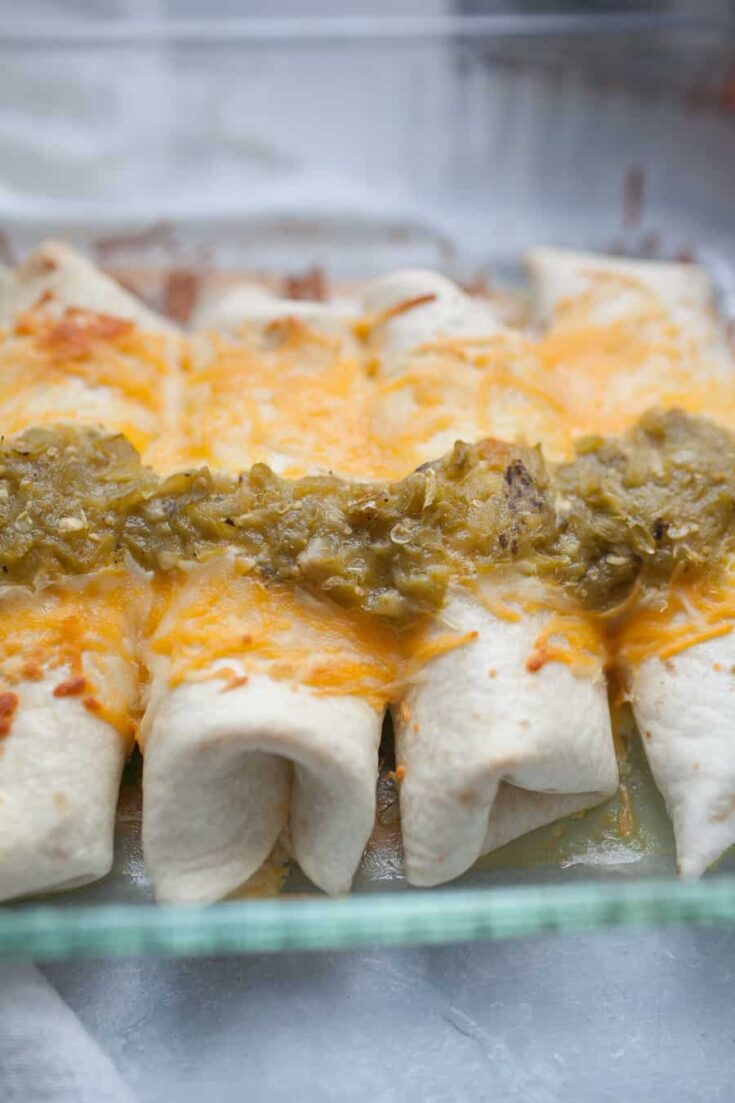 Sour Cream Chicken Enchiladas are the perfect weeknight dinner that will gather your family around the table. These enchiladas are made with flour tortillas, instead of traditionally used corn tortillas, and are stuffed with shredded chicken mixed with cream of chicken soup, sour cream, and cheese. The whole dish is topped with cheese and spicy green chile sauce! It's packed with flavor and the perfect dish for your family!?