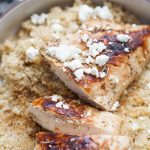 A plate with Pan Seared Peach Balsamic Chicken and couscous on it.