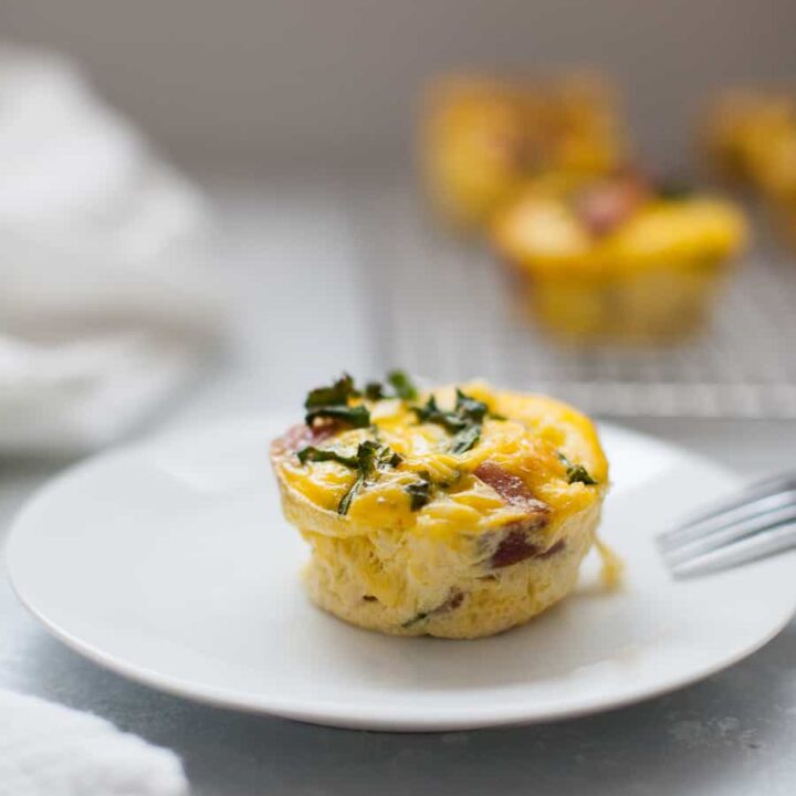 Make Ahead Egg Muffins are a perfect solution for making breakfast ahead of time for the week, to take to work or for brunch! Made with smoked sausage, kale, sundried tomatoes and feta, these egg muffins are small but packed with flavor.?