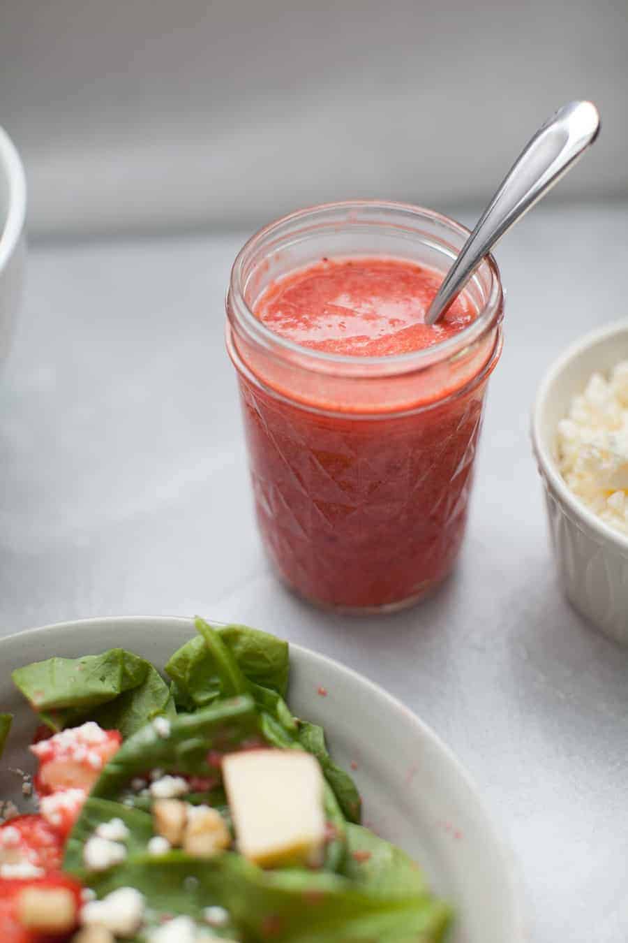 Add this?Strawberry Vinaigrette Spinach Salad to your regular diner rotation! This salad has a spinach base, topped with walnuts, goat cheese, fresh strawberries, diced apples and finally tossed in a homemade strawberry vinaigrette dressing. The dressing is a perfect balance of sweet and tangy. This salad is perfect for any time of year, but especially satisfying for summer and fall!