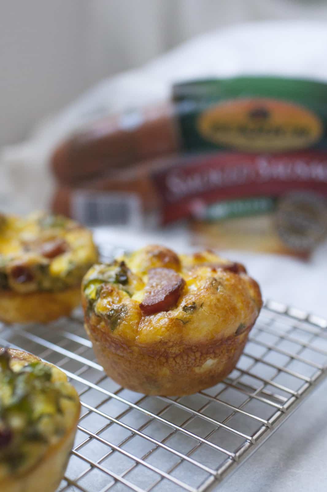 Make Ahead Egg Muffins are a perfect solution for making breakfast ahead of time for the week, to take to work or for brunch! Made with smoked sausage, kale, sundried tomatoes and feta, these egg muffins are small but packed with flavor.?