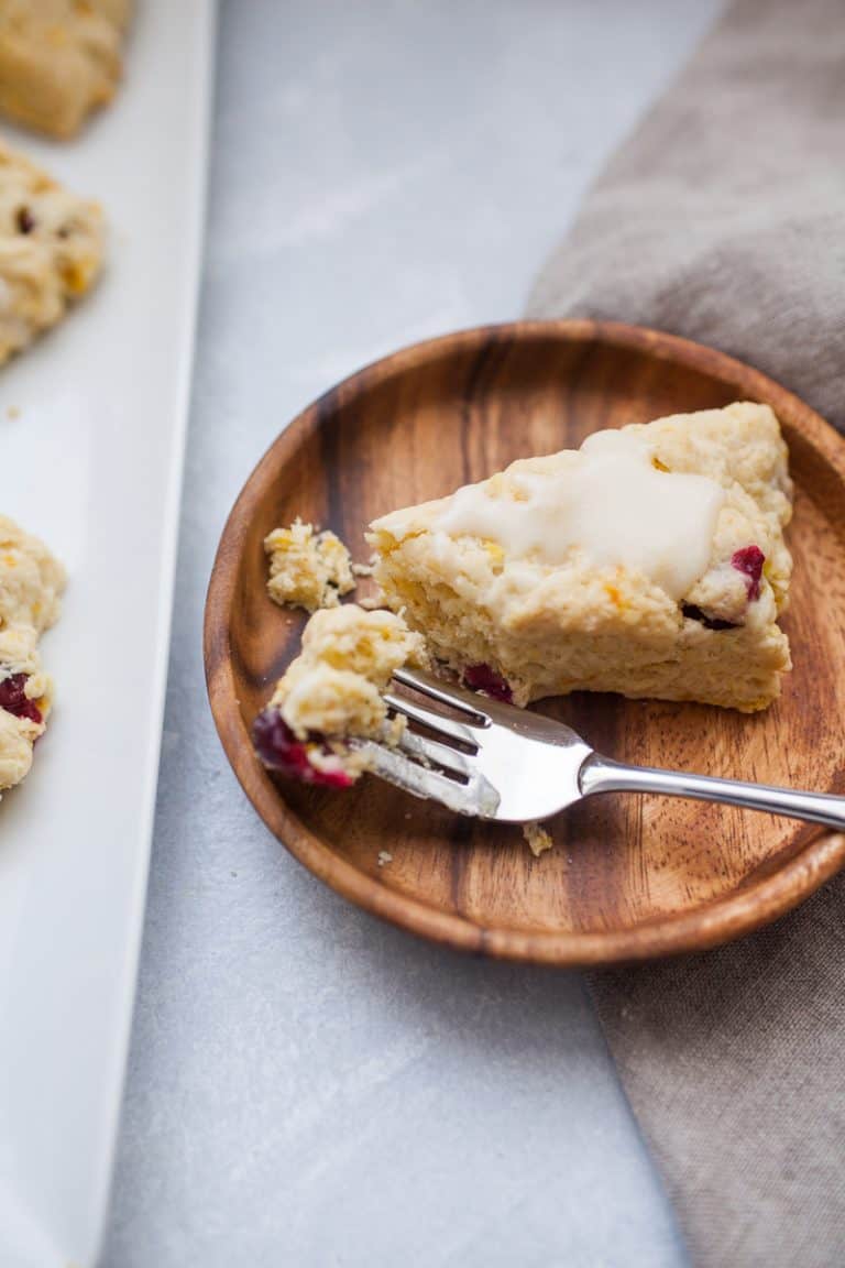 a plate with a cranberry orange scone