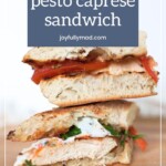A chicken pesto caprese sandwich with slices of chicken, pesto, mozzarella, and tomatoes on bread. The sandwich is halved and stacked, with a text overlay reading "chicken pesto caprese sandwich." Perfectly paired with a simple fruit salad recipe for a delightful meal.