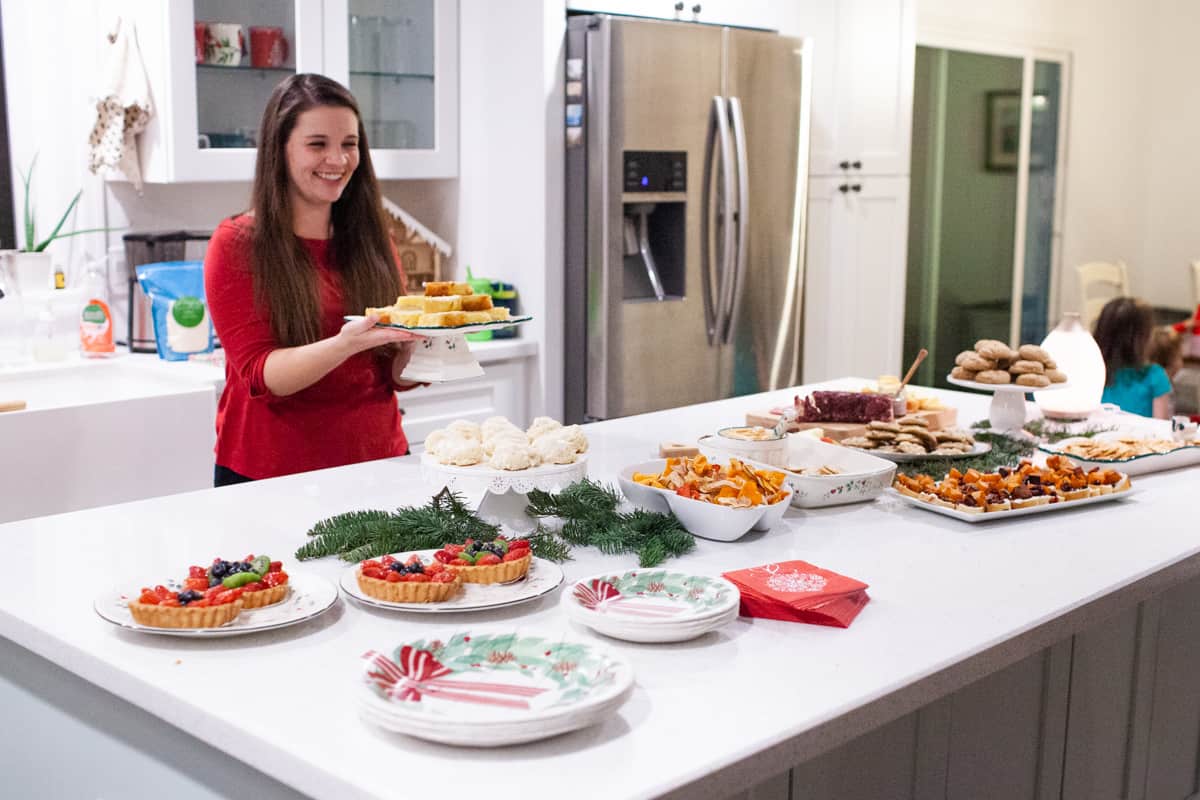madison preparing a holiday spread for a wine party