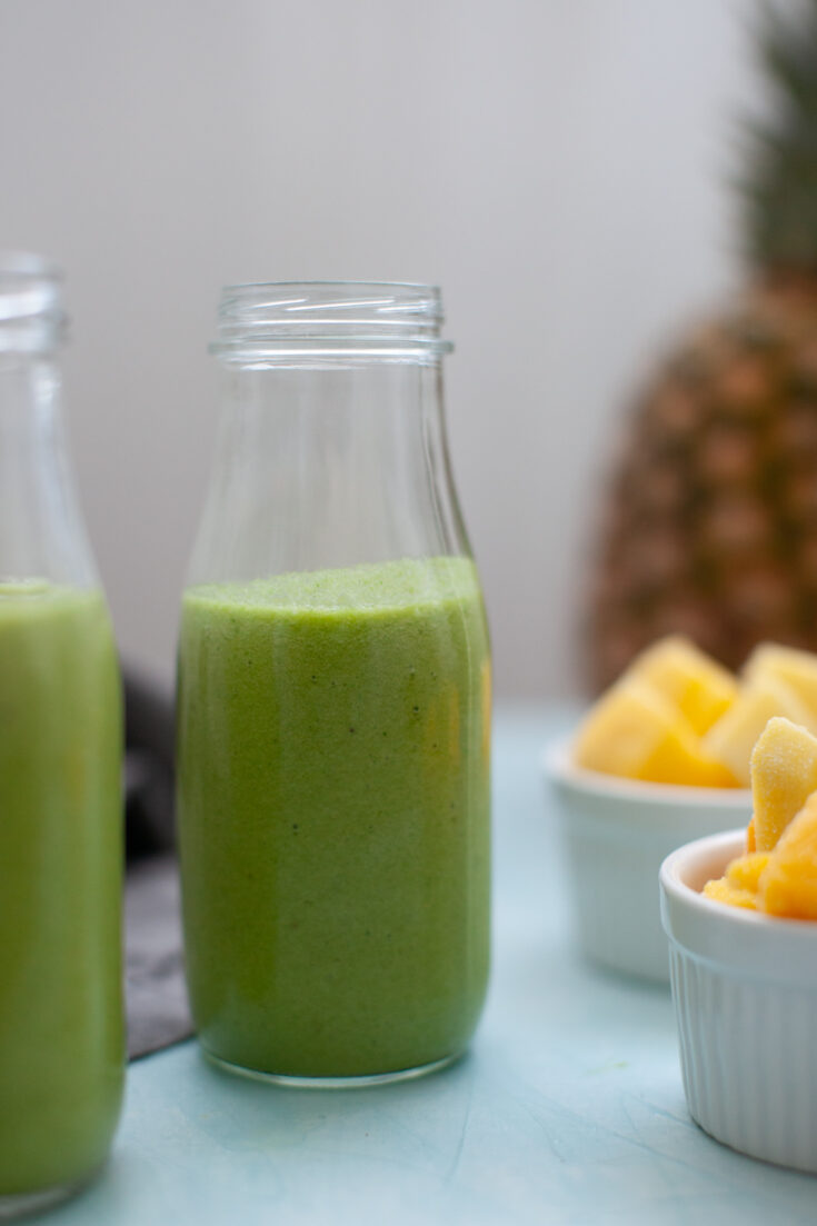 a glass of a Tropical Island Green Smoothie