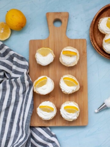 lemon cheesecakes on a wood board