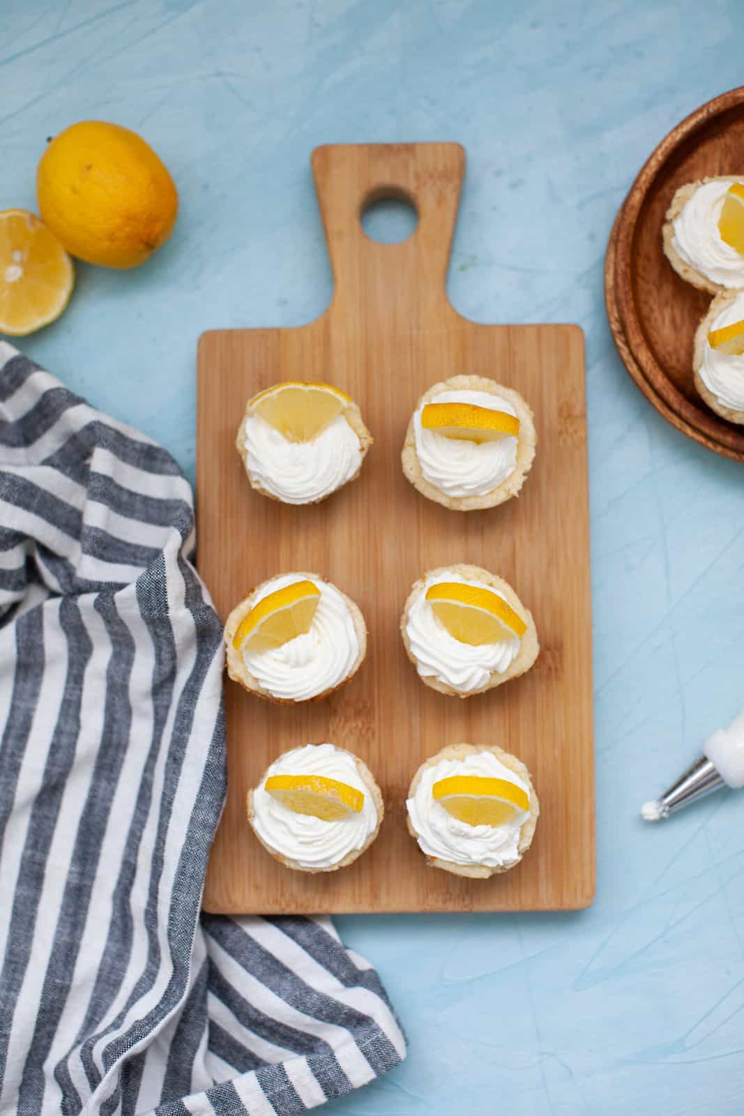 lemon cheesecakes on a wood board