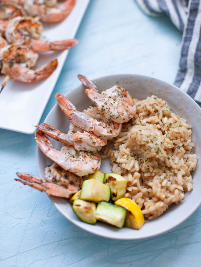 a rice bowl with grilled shrimp