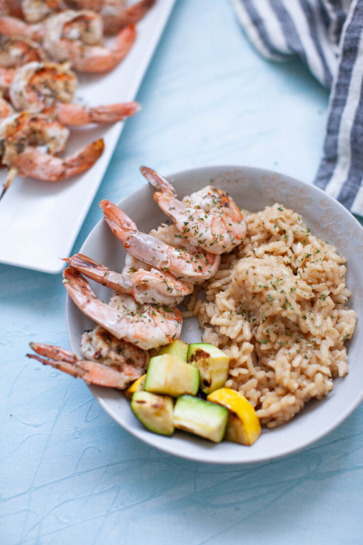 a rice bowl with grilled shrimp