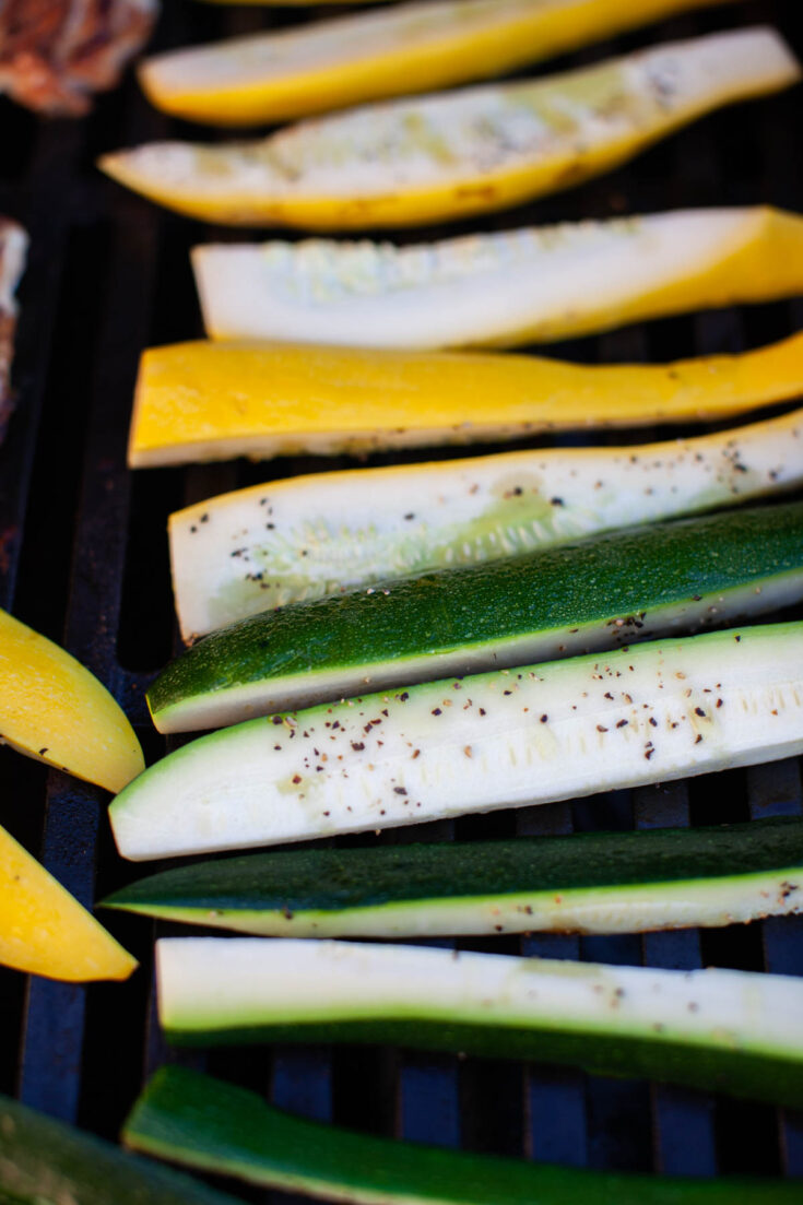 zucchini and squash with salt and pepper on the grill