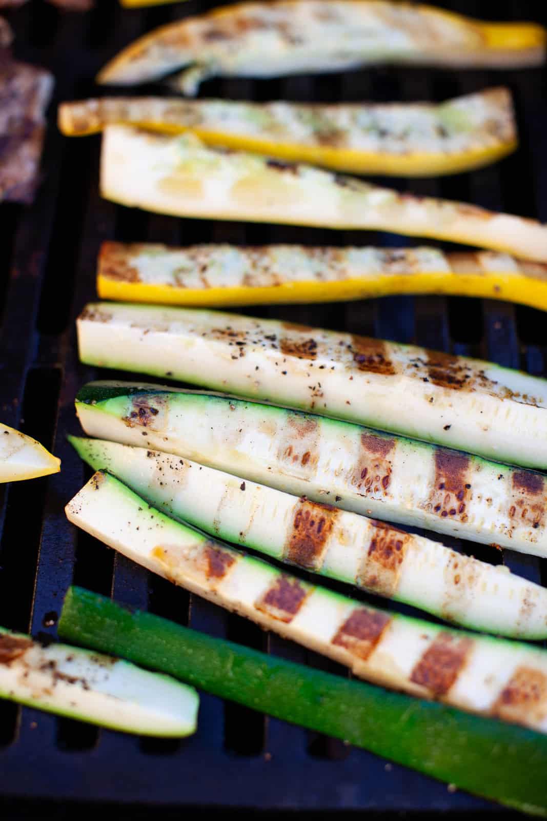 zucchini and squash cooking on the grill