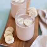 two glass jars with chocolate smoothies