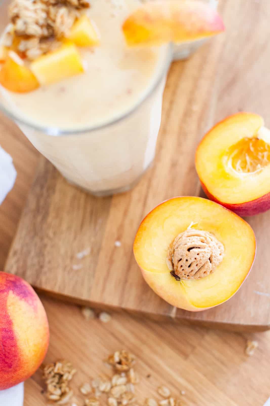 cut peaches on a cutting board 