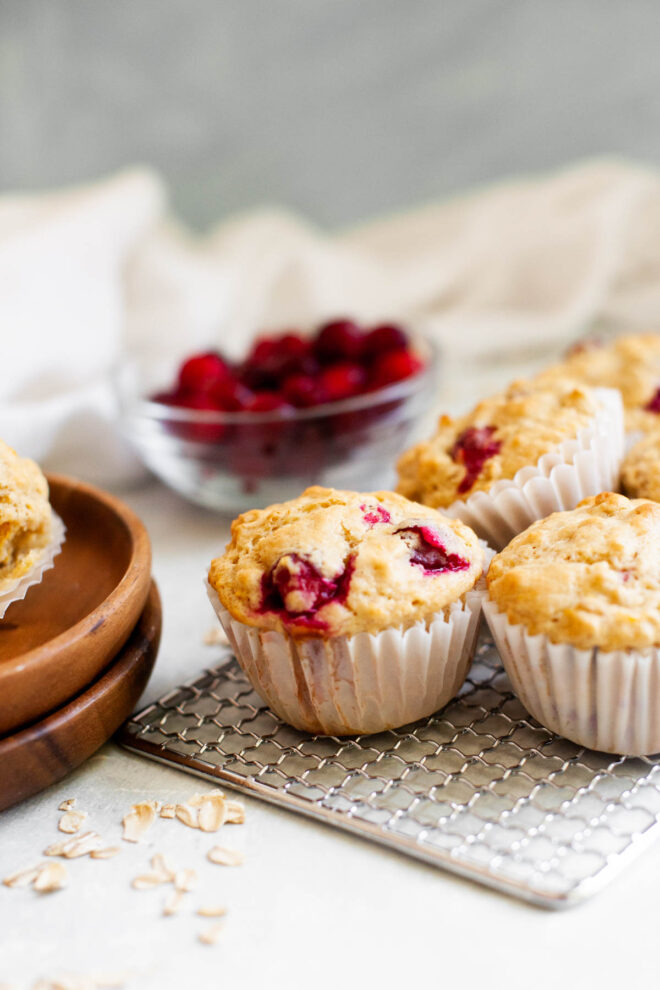 wooden plates of cranberry muffins