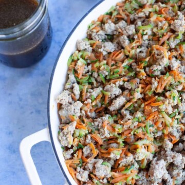 stir fry sauce in a jar next to turkey stir fry in a pot