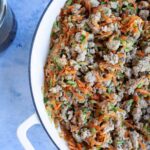 cooked turkey, carrots and zucchini in a white pot